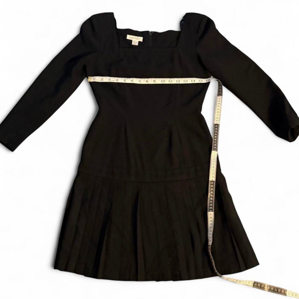 Good condition. Ann Taylor Black Ruffle
Trim Long Sleeve Dress

Women's Size 4